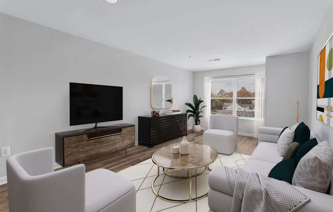 a living room with white furniture and a television