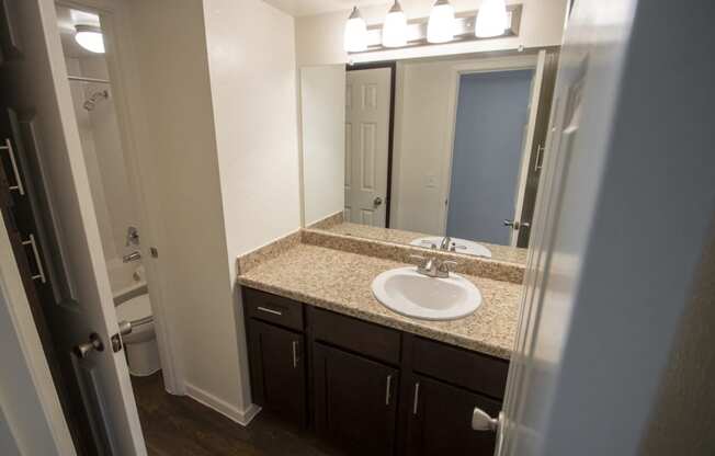 This is a photo of the bathroom of a fully upgraded 1084 square foot 2 bedroom townhome at The Biltmore Apartments in Dallas, TX.