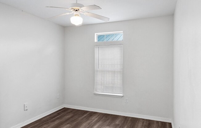 Bedroom with ceiling fan at Tidwell Estates in Houston TX