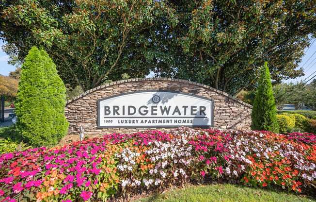 the sign for bridgewater at the entrance of the subdivision with flowers