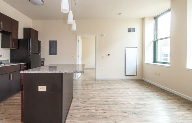 a kitchen and living room in a 555 waverly unit