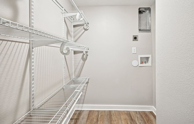 Convenient and spacious laundry closet in the D5 floor plan at Windridge On The Parkway Apartments in Dallas, TX