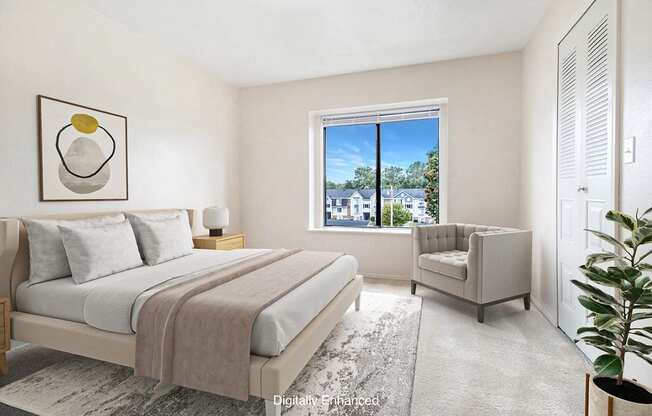 A spacious bedroom with a large bed and a window at Canal Club Apartments in Lansing, MI
