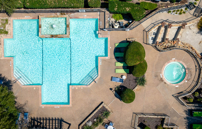 arial view of a large swimming pool with trees in the background