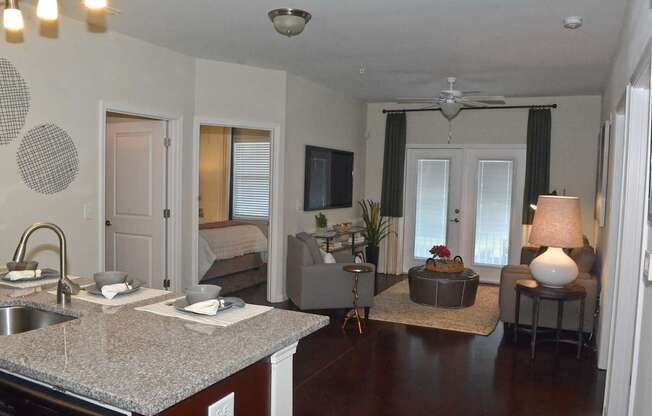 A kitchen with a counter top and a sink.