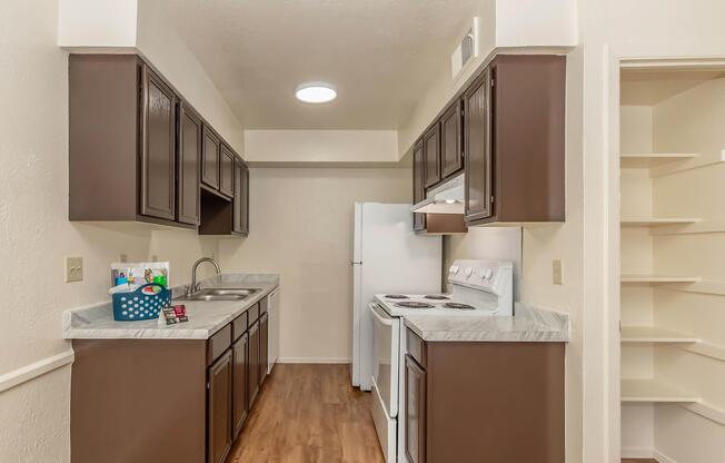 a kitchen with a sink and a mirror