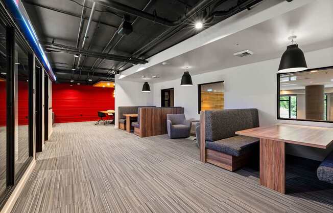 A modern office space with wooden floors and furniture.