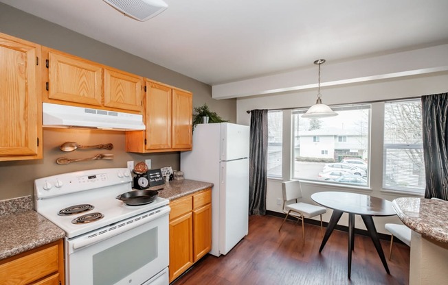 a kitchen and dining area at Brentwood Estates