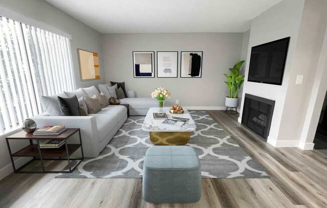 a living room with gray walls and a gray and white rug