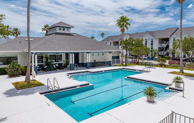 the preserve at ballantyne commons pool and building with palm trees