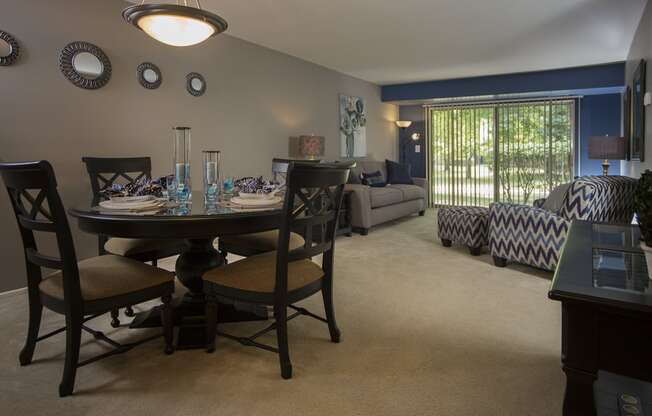 Open living area with large dining room at Westwood Village Apartments in Michigan