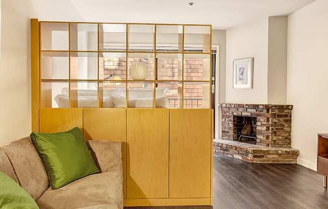a living room with a couch and a fireplace