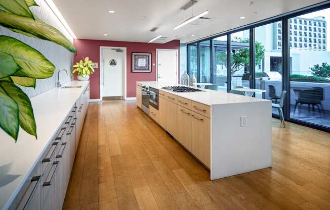 A kitchen with wooden floors and white countertops.