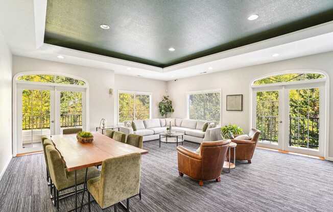 A sitting room with a wooden table and chairs.