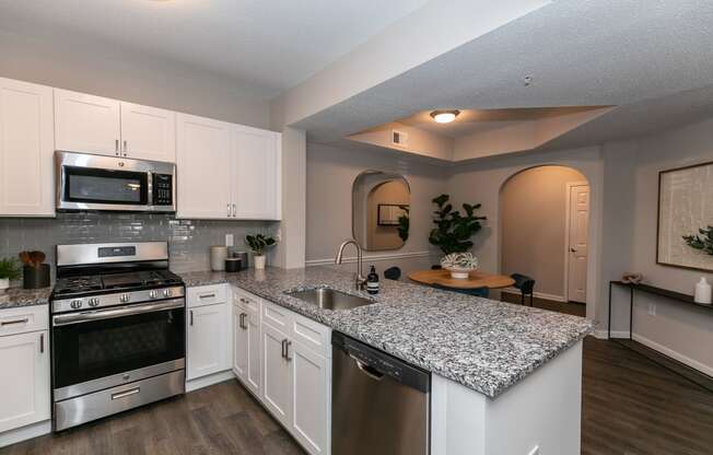 a kitchen with granite counter tops and stainless steel appliances at Willowest in Lindbergh, Atlanta, GA, 30318