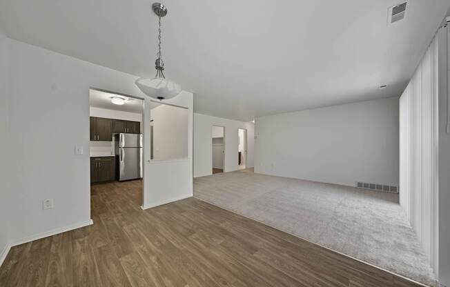 Open Living/Dining Room with natural light at Franklin River Apartments in Southfield, MIng Room with natural light at Franklin River Apartments in Southfield, MI