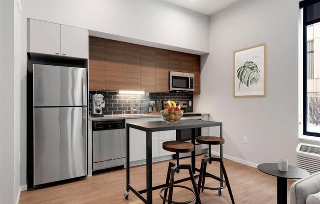 modern kitchen with wood cabinets and stainless steel appliances
