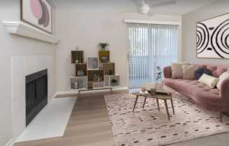 a living room with a fireplace and a pink couch