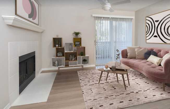 a living room with a fireplace and a pink couch