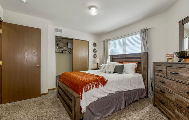 Cartpeted Bedroom With Large Windows