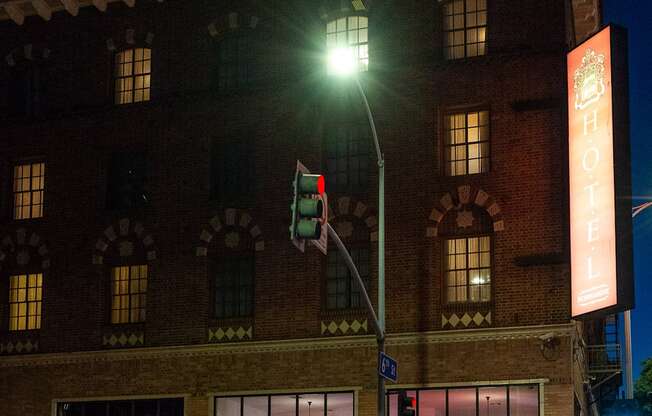 a traffic light on a pole in front of a building