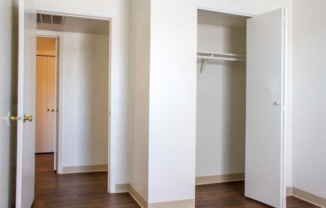 Bedroom with Hardwood Style Flooring and Closet