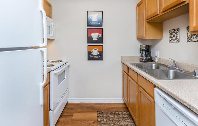 a kitchen with a sink and a refrigerator