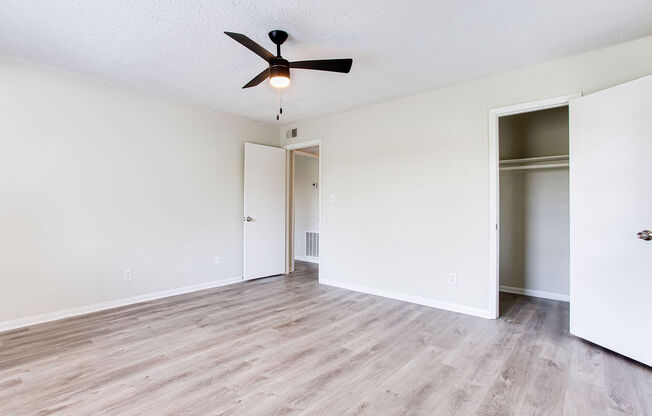 an empty bedroom with a ceiling fan  at The Oasis on Cascade, Georgia, 30310