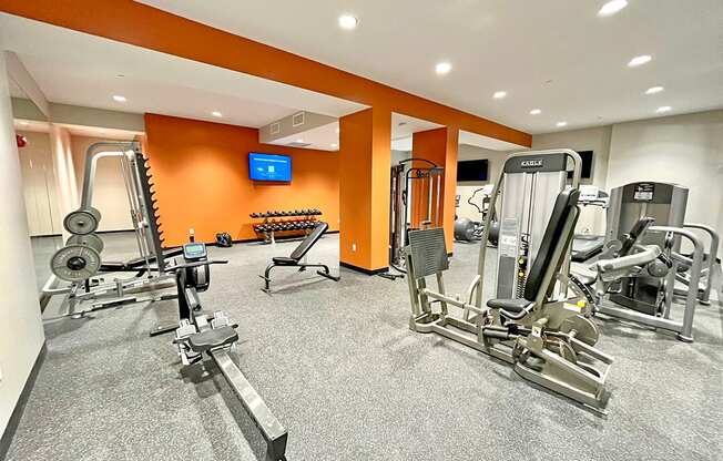 large fitness center with exercise equipment at The Residences at Delmar DivINe, St Louis, MO, 63112