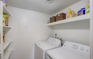 a laundry room with a washer and dryer