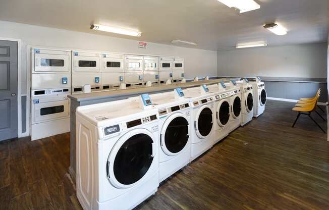 a row of washing machines in a public laundromat