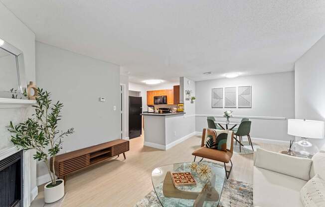 A living room with a fireplace, a couch, and a coffee table.