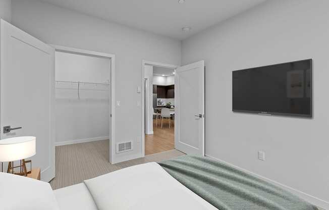 a bedroom with a bed and a tv