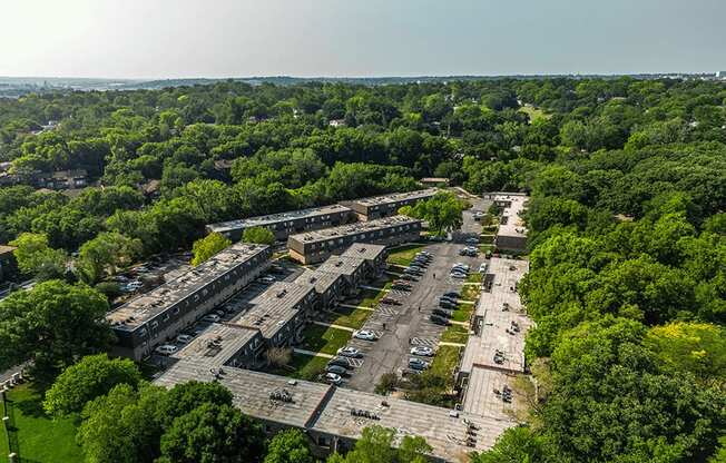 an aerial view of an abandoned building surrounded by trees