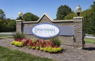 the sign at the entrance of whitehall estates