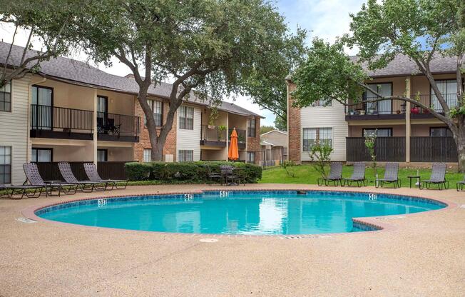 a large pool of water in front of a house