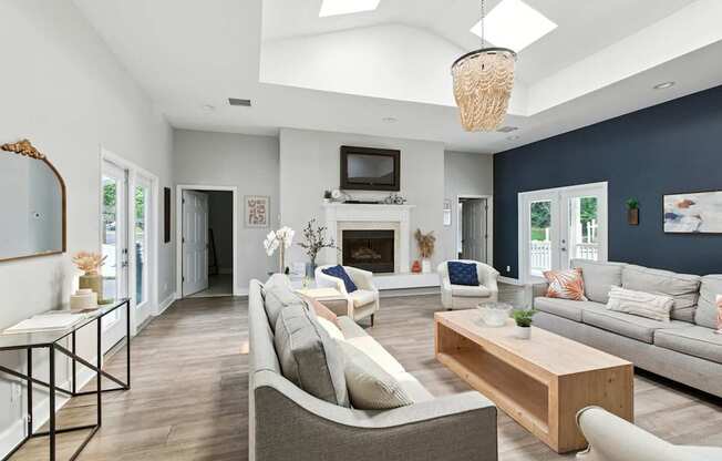 A modern living room with a fireplace and a television.