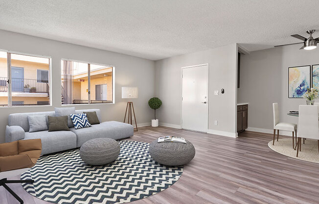 Living room with hardwood floor and view of dining area.