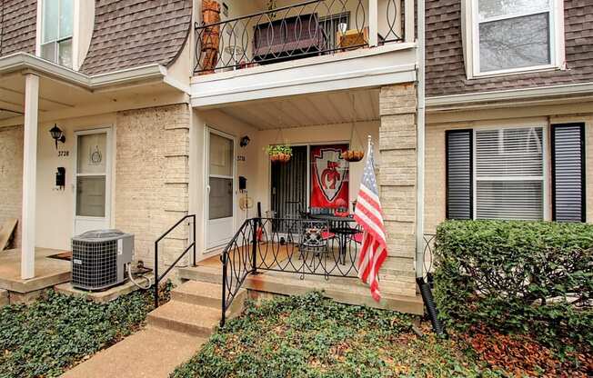 Exterior image of building with stairs and flag