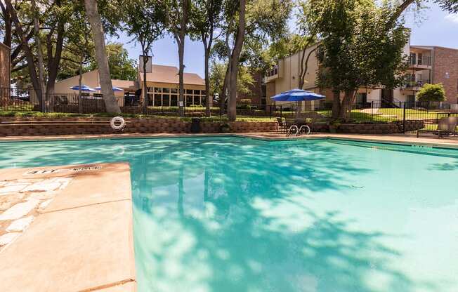 This is a photo of the pool area at Canyon Creek Apartments in Dallas, TX.