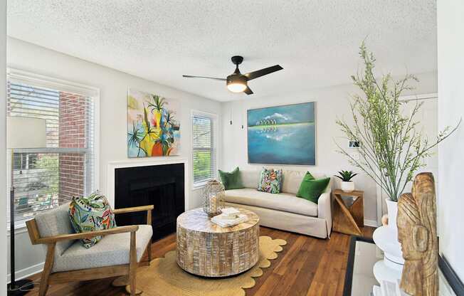 a living room with a couch and a ceiling fan at Elme Druid Hills, Atlanta, GA