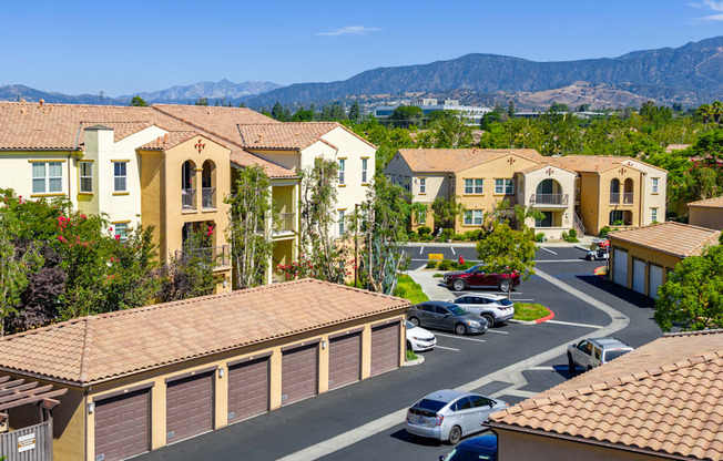 A residential area with houses and cars.