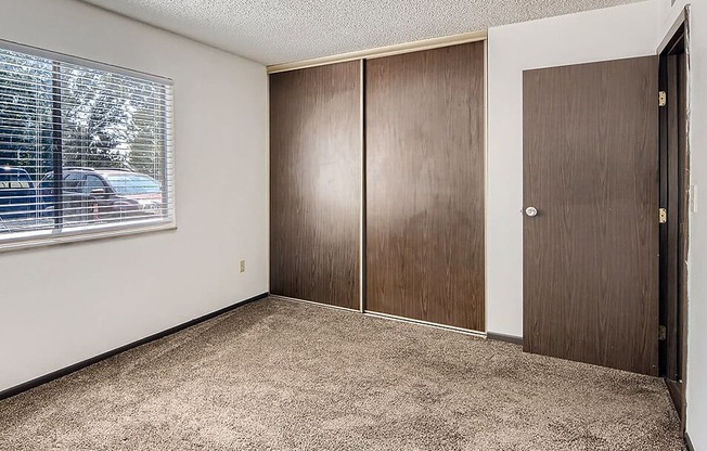 bedroom with connected closet at country green apartments