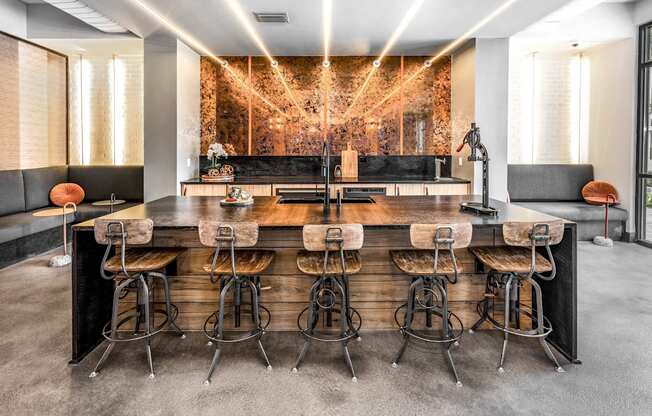 a large bar with bar stools in a room with a couch and a mirrorat The Overlook, Winter Garden, Florida
