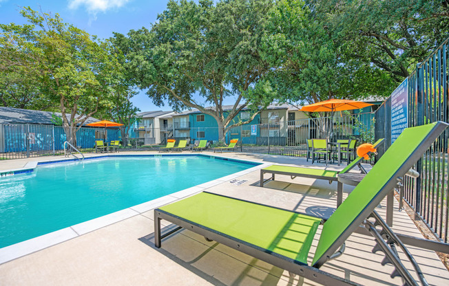 our apartments have a resort style pool and lounge chairs