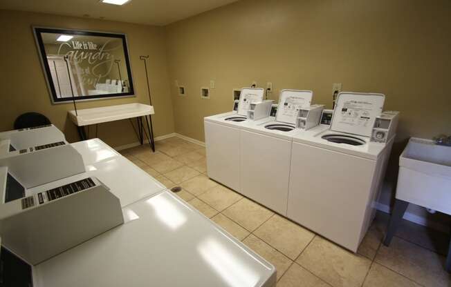 This is a photo of the clothes care center at Trails of Saddlebrook Apartments in Florence, KY.