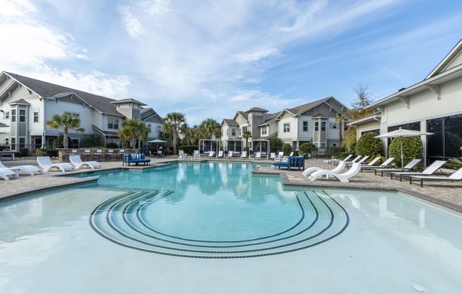 the preserve at ballantyne commons resort style swimming pool with lounge chairs and houses