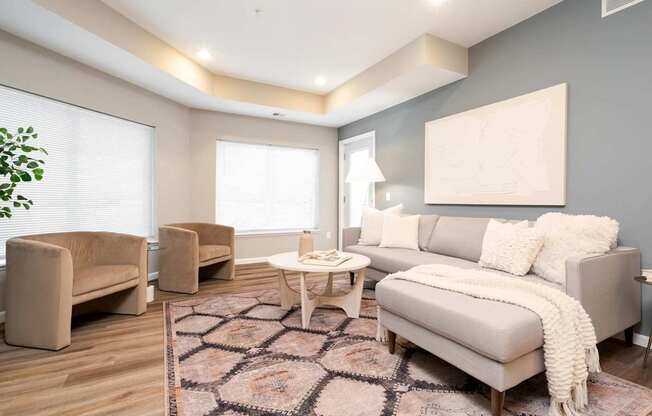 a living room with a couch and chairs. Circle Pines, MN Lexington Lofts