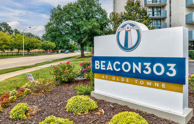 the enclave at olde towne sign in front of an apartment building