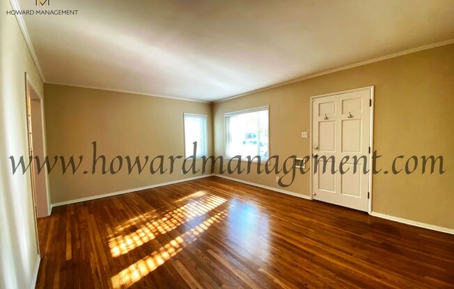 Lovely home with extra large backyard, converted garage and hardwood floors!